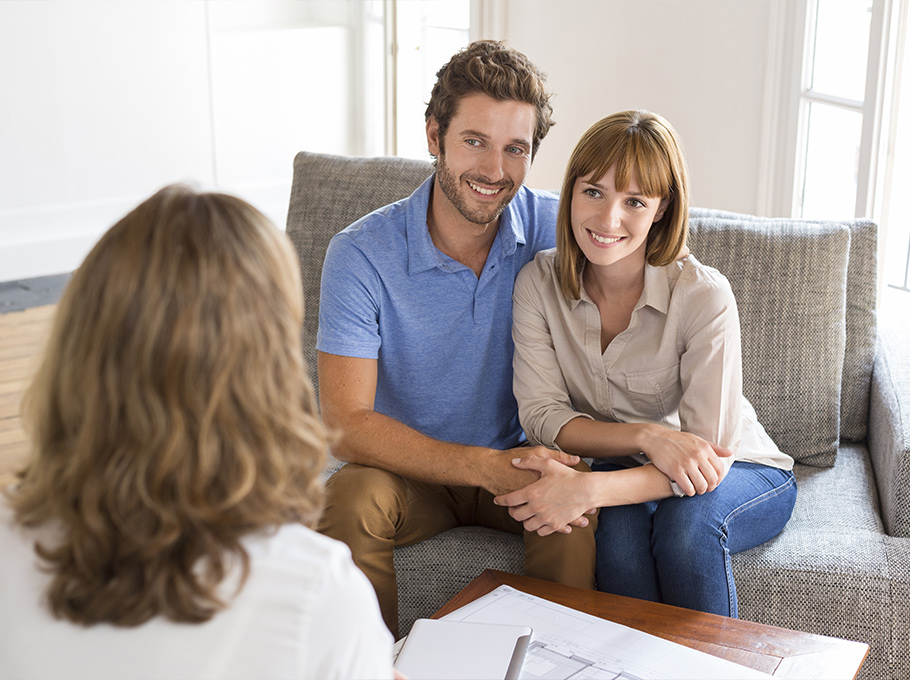 thirty year old couple meeting financial adviser for investment